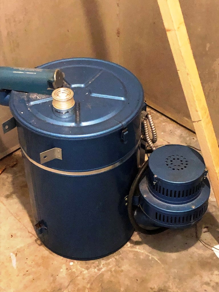 Detached central vac unit in storage room